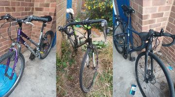 Three bicycles stood up next to different walls, these were returned to owners  after being stolen