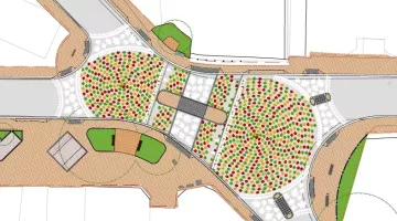 An overhead diagram of the proposed new crossroads, showing the existing mini-roundabouts repainted with concentric circles of multi-coloured leaves and new pedestrians crossings installed