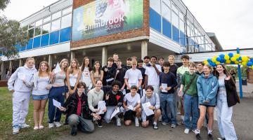GCSE students with their results outside The Emmbrook School