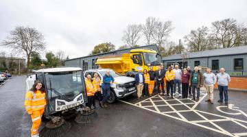Depot staff and vehicles including gritter and road sweeper outside Toutley Depot.
