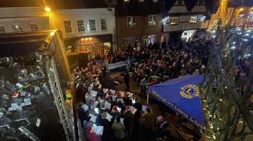 photo of the Wokingham Winter Carnival taken from an upstairs window, with crowds gathered in the town centre