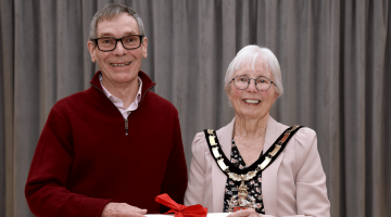 Bob Collis collecting his Mayor's Honour Award
