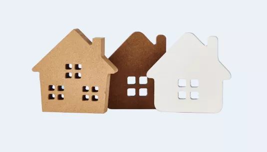 Three houses on a blue background