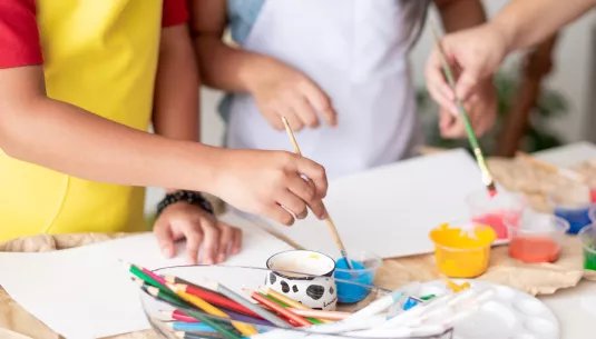 Two children painting