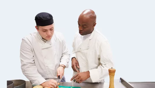 A young person training to be a chef