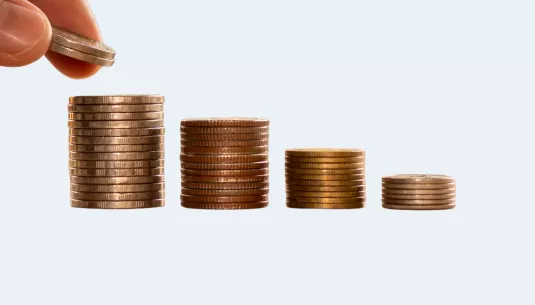 four piles of stacked coins