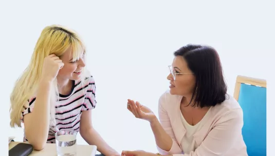 A young person talking with a health professional