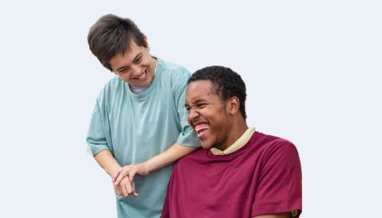 Two young adults laughing together
