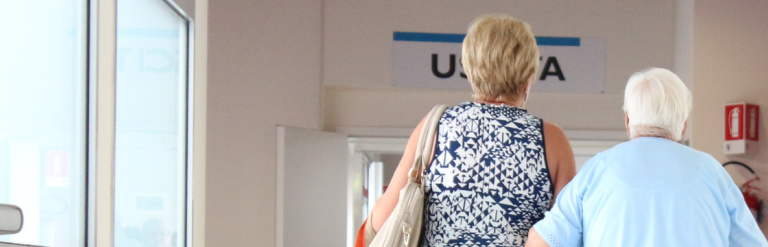 Two ladies walking out of hospital