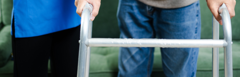 Male gentleman using a walking frame