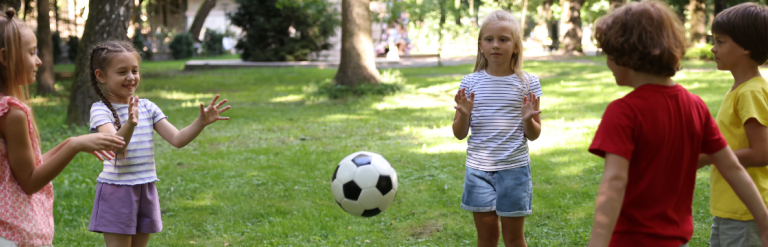 Group of children playing with a ball
